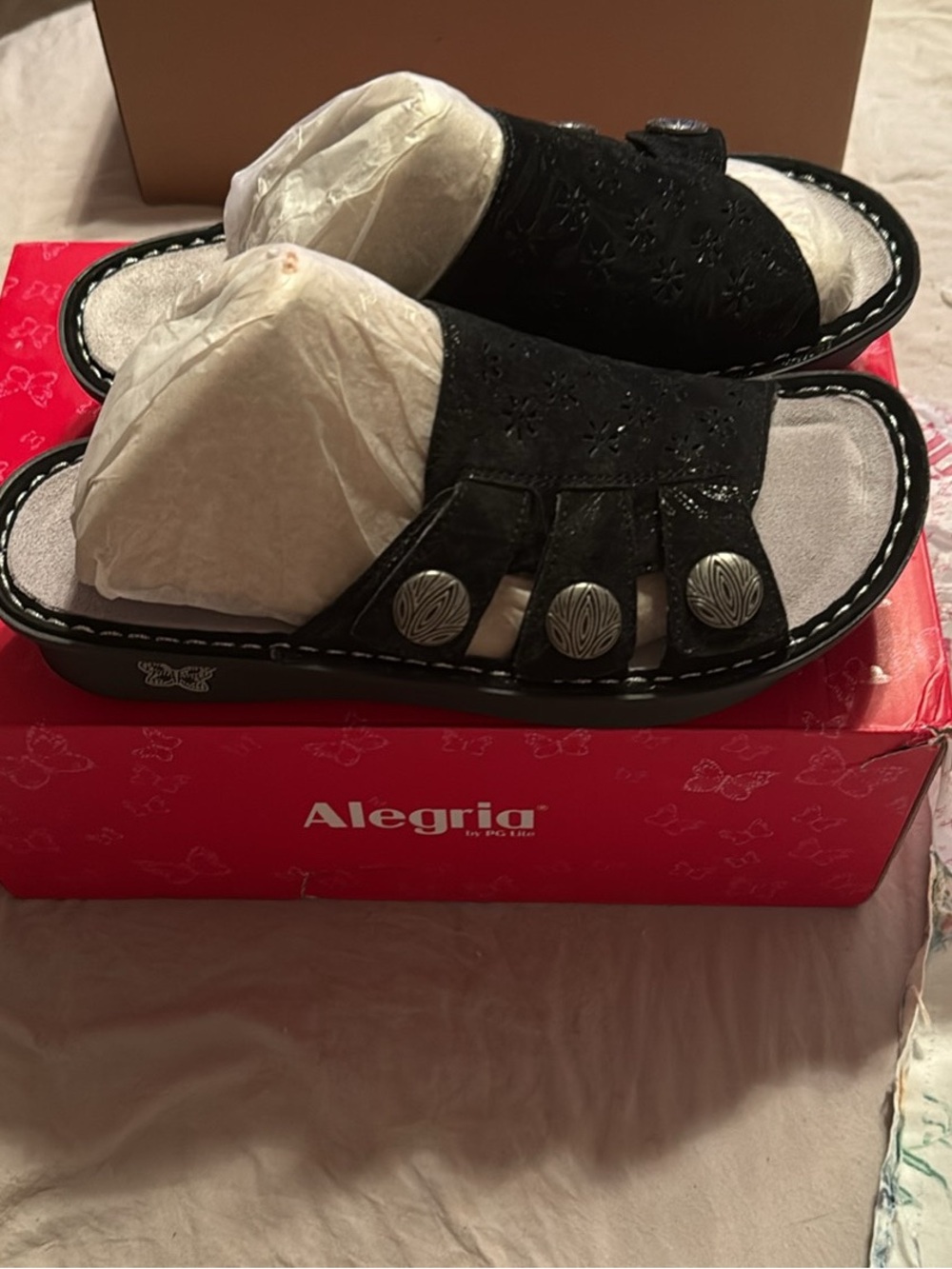 Alegria Black Slip-On Sandals with Decorative Silver Buttons
